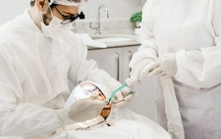 Dentists working on a patient