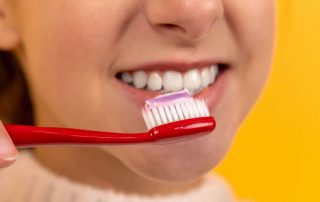 Girl brushing her teeth