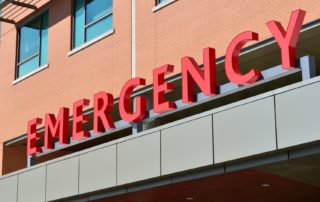 red emergency sign on side of building