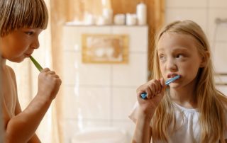 Kids brushing their teeth