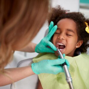 child getting a dental cleaning