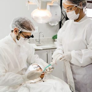 dentist and tech working on patient