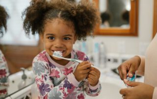 Girl brushing her teeth