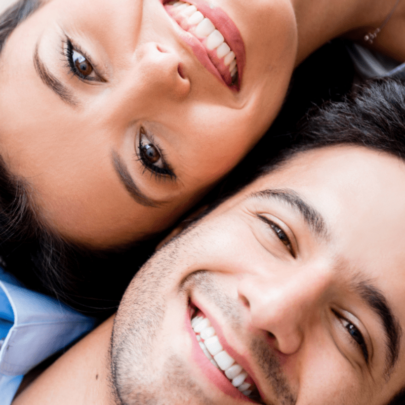 couple smiling with teeth