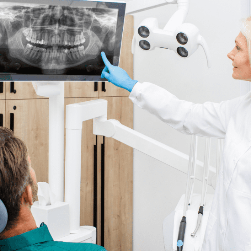 health professional talks to the patient before oral surgery
