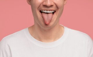 what a healthy tongue look like, man sticking out tongue