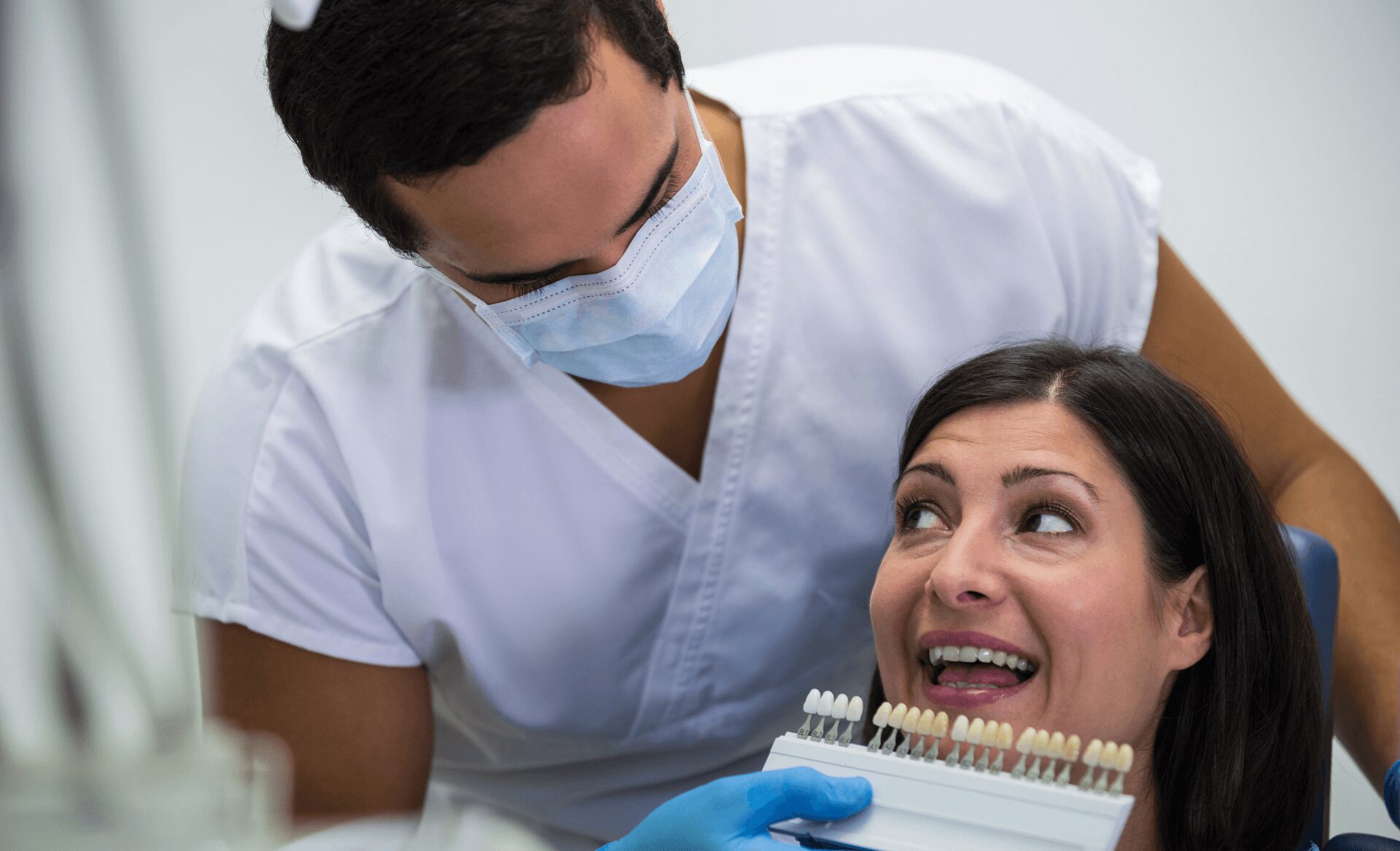 teeth whitening female patient checking color shade