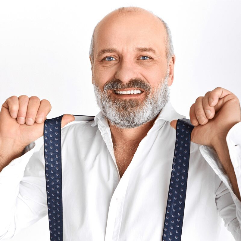 elderly man smiling showing bright white teeth